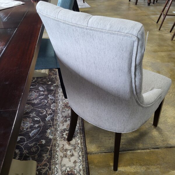 pair of grey tufted dining chairs