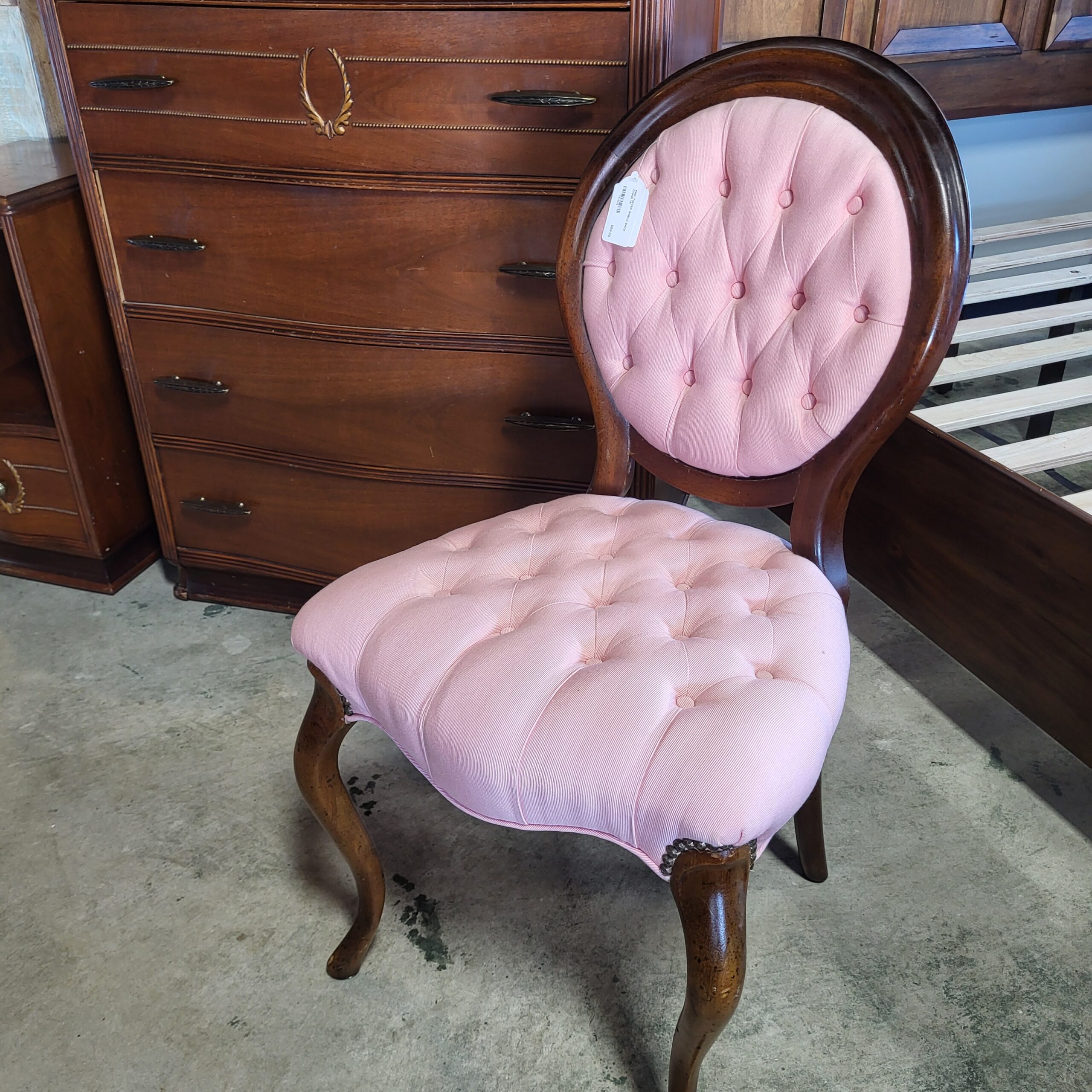 pink tufted shield back chair