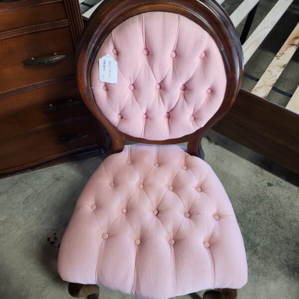 pink tufted shield back chair