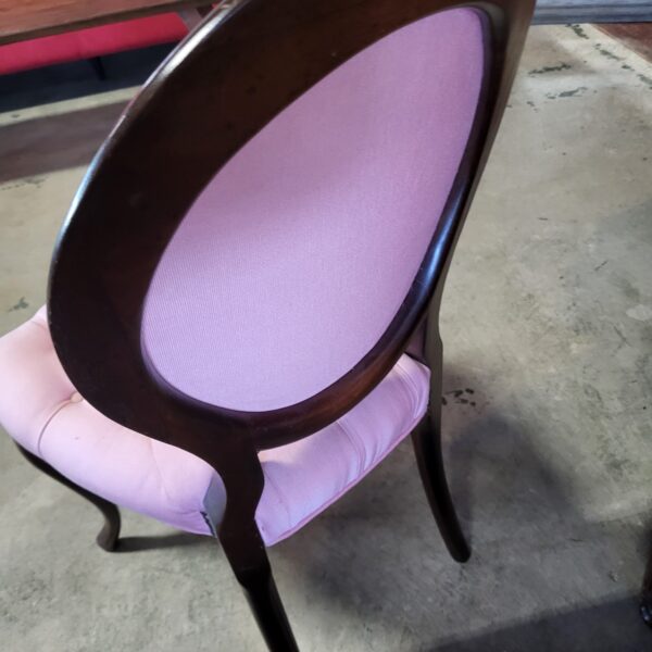 pink tufted shield back chair